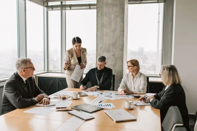 Business partners reviewing documents together in an office