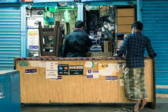 People at a small business counter in Bengaluru